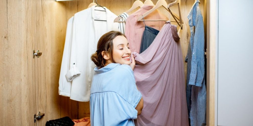 Lady cuddling wardrobe