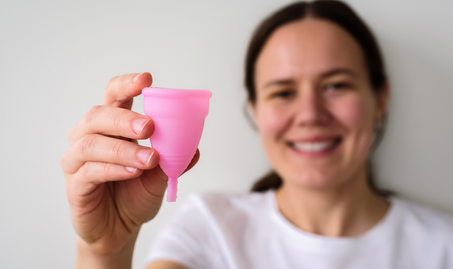 A lady holding a period cup