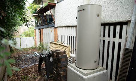 Image of hot water system on side of house