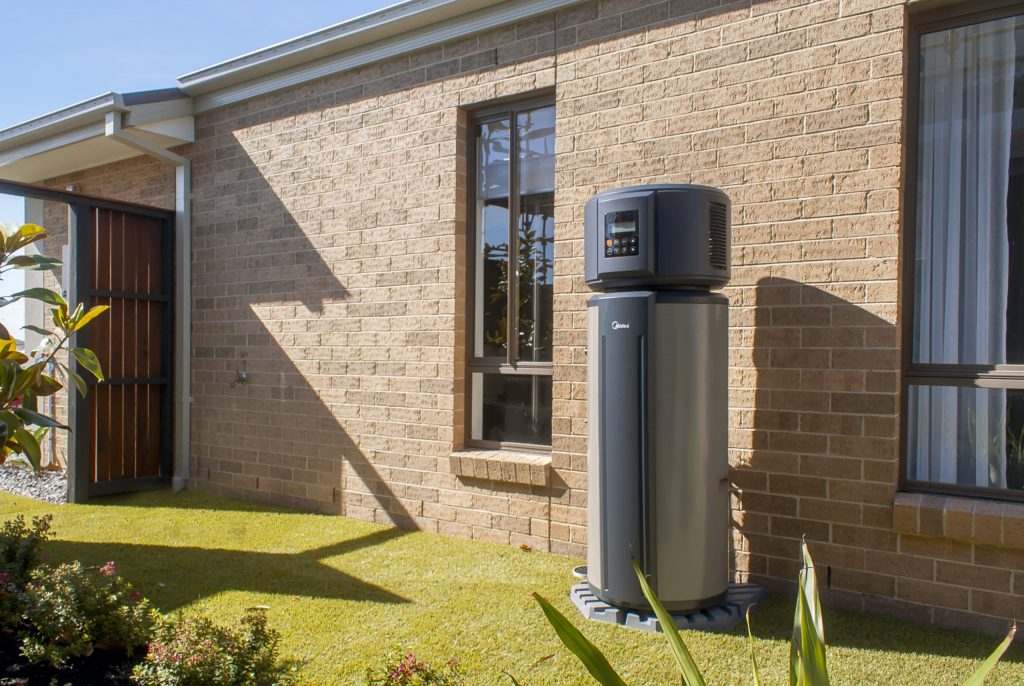 Photo of heat pump on a sunny side of house