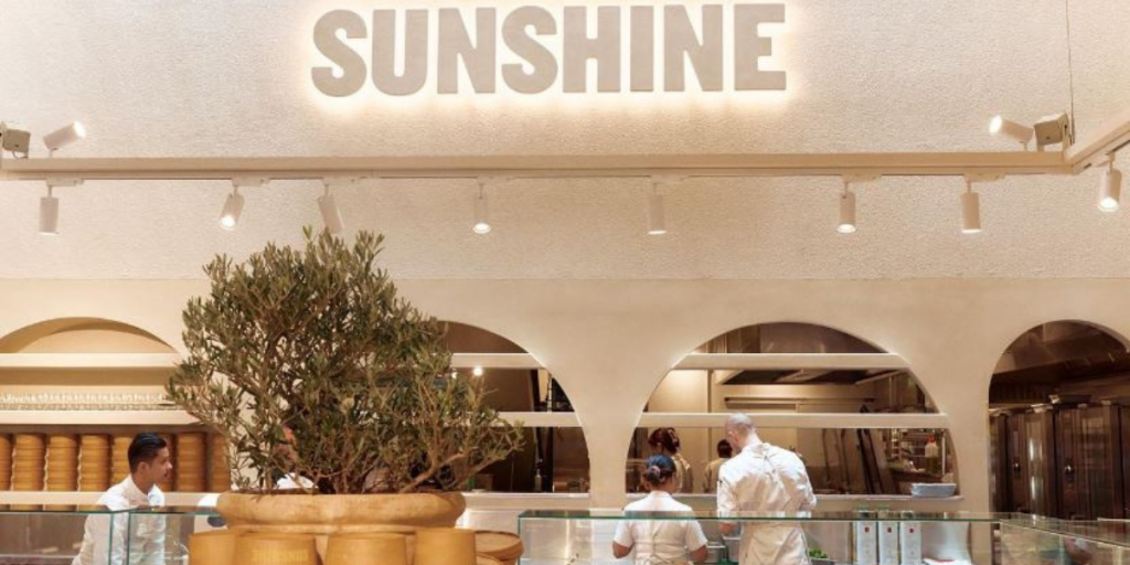 A restaurant with the word sunshine on the wall