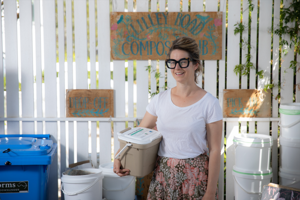 Hannah Churton in front of her public compost garden that she made in her front garage.