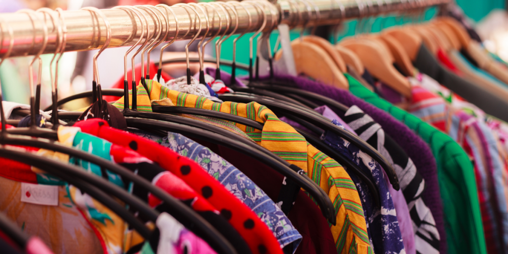 colourful clothing hanging on clothes rack
