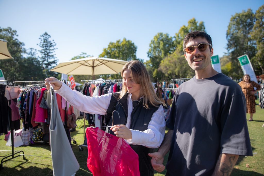 Young people thrifting in the sustainable shopping zone