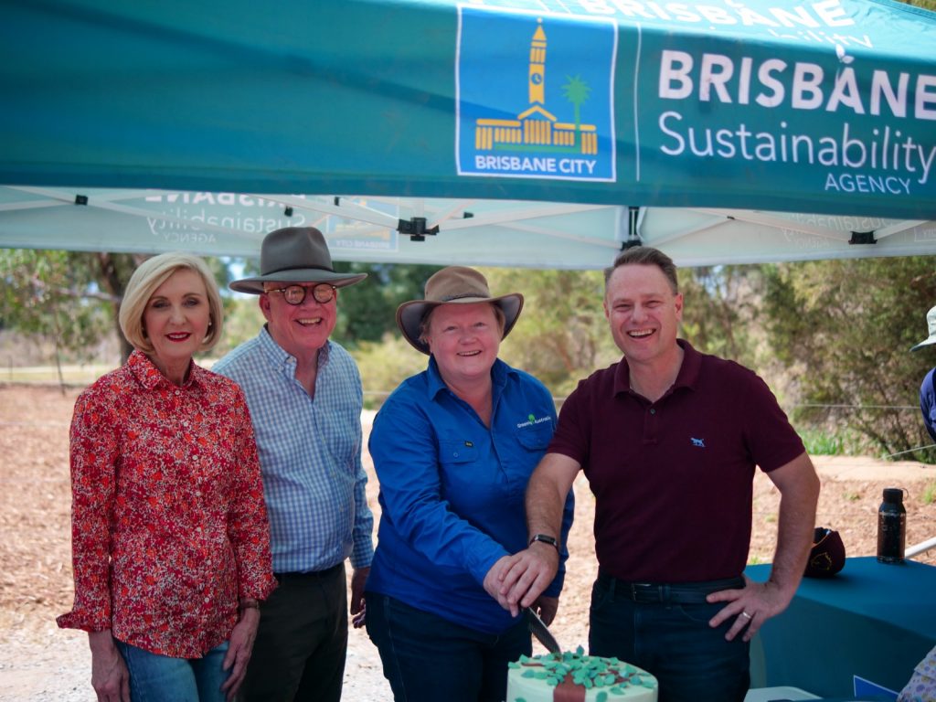 From left to right, Councilor Tracy Davis, Brisbane Sustainability Agency Chair Nigel Chamier, Greening Australia CEO Heather Campbell and Lord Mayor Adrian Schrinner cutting the ceremonial cake to celebrate the launch of the partnership.