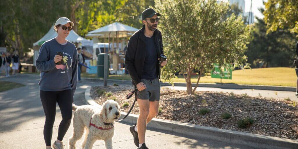 Couple and dog walking in a park