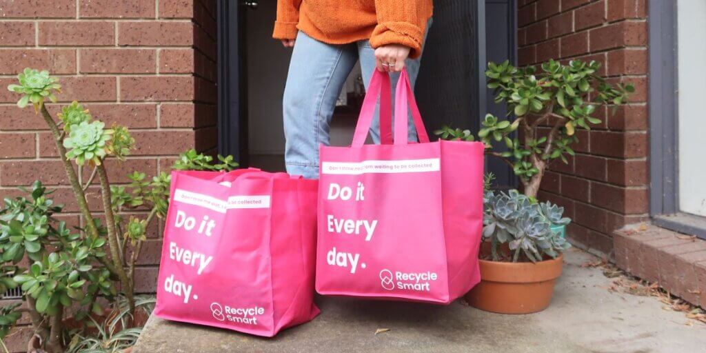 Person holding full grocery bags